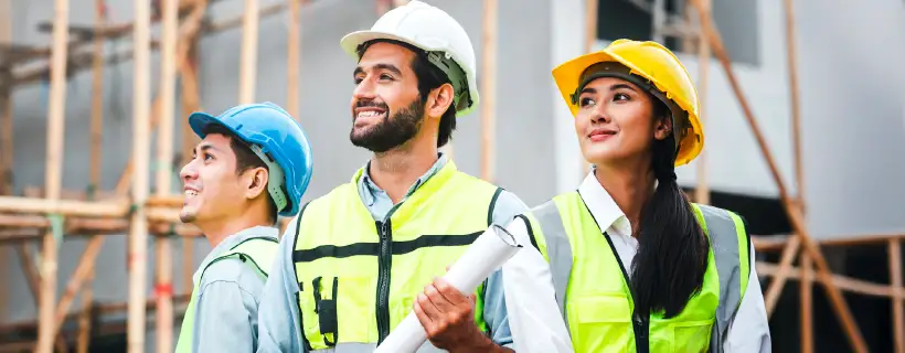 a contractor talking with construction site worker pointing at the site